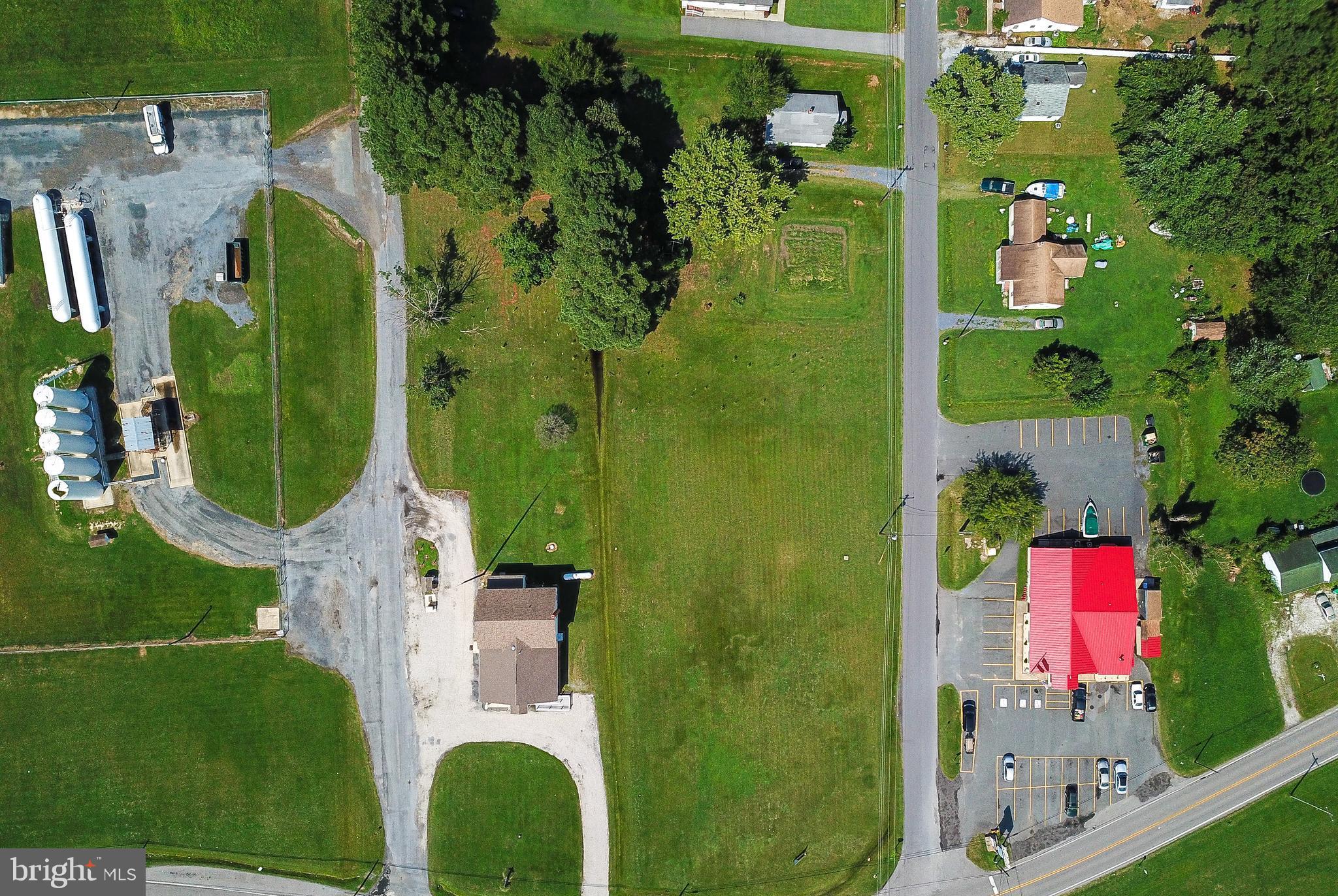 2918 Old Rte 50 Cambridge, MD 21613 - Photo 13 of 17 an aerial view of a residential apartment building with a yard and plants