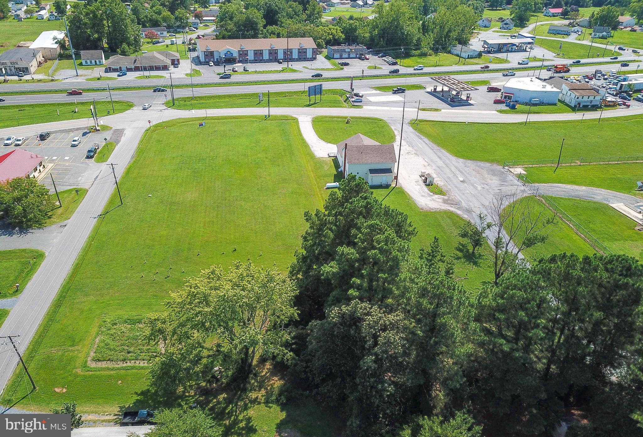 2918 Old Rte 50 Cambridge, MD 21613 - Photo 8 of 17 a view of a swimming pool with a patio and a yard