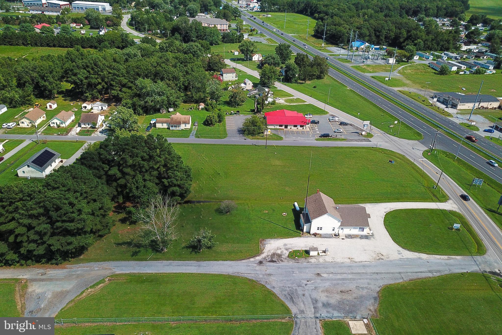 2918 Old Rte 50 Cambridge, MD 21613 - Photo 10 of 17 a wooden floor with some trees in the background