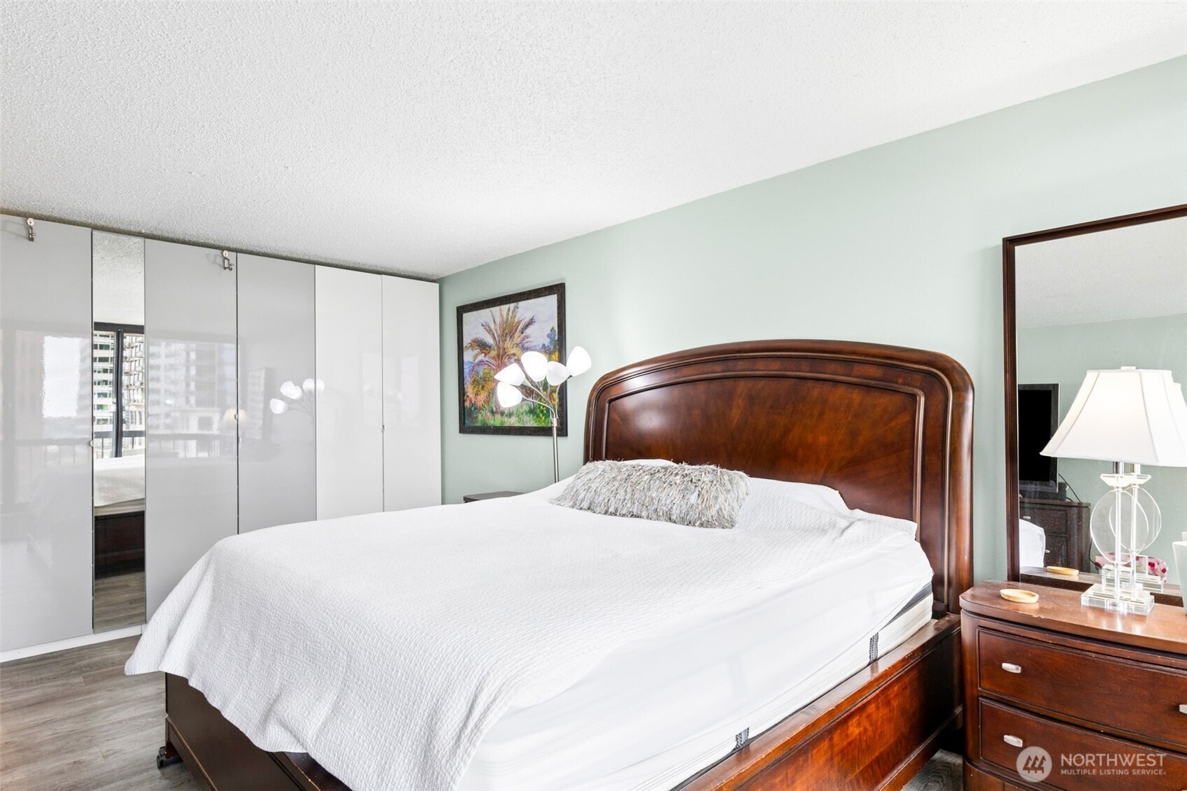 2100 3rd Avenue, Unit 802 Seattle, WA 98121 - Photo 13 of 35 a bedroom with a bed and a lamp