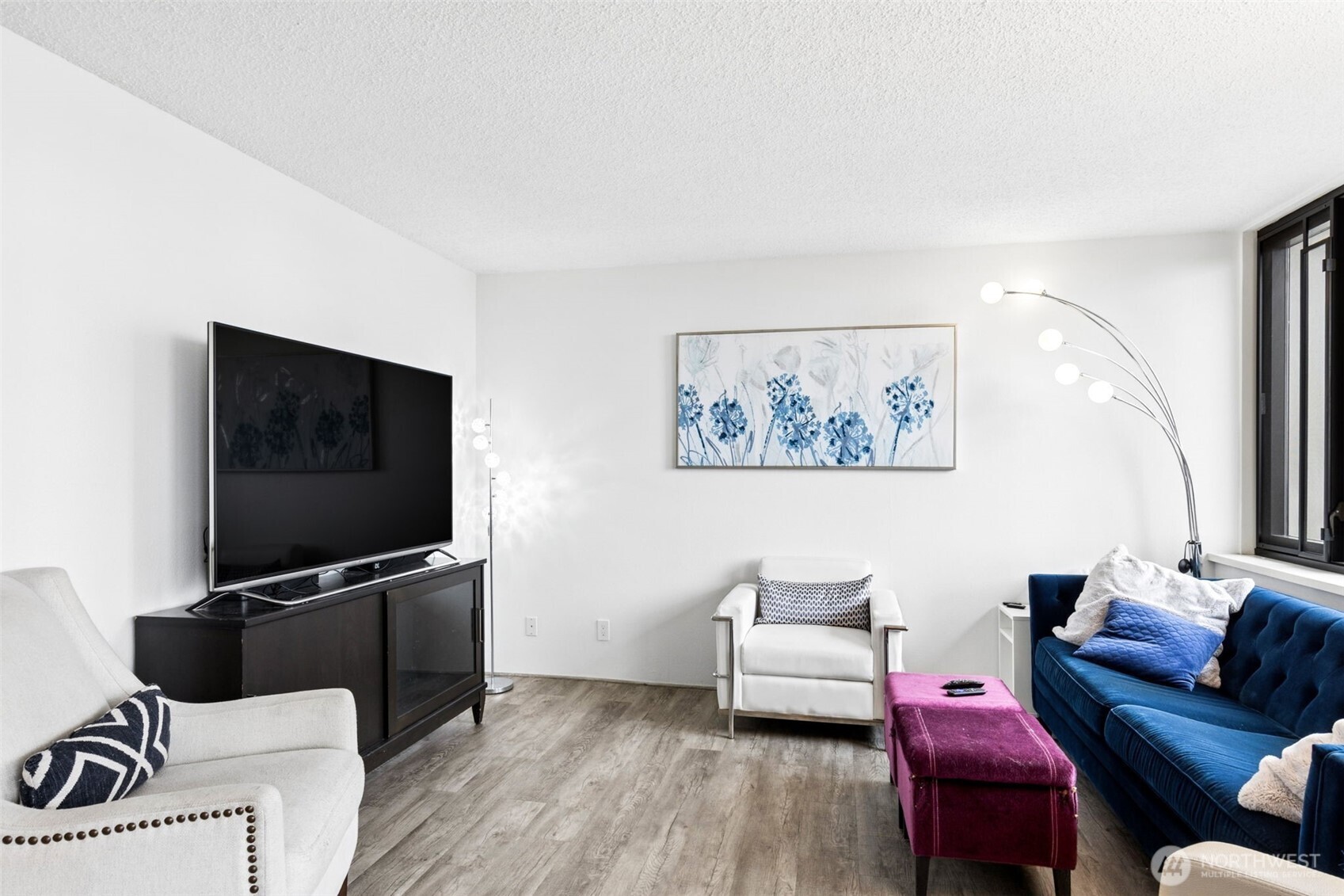 2100 3rd Avenue, Unit 802 Seattle, WA 98121 - Photo 6 of 35 a living room with furniture and a flat screen tv