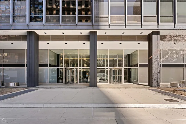 a view of swimming pool with seating space