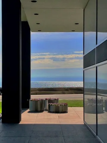 a view of a building with a yard