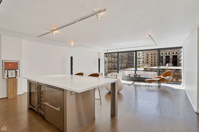 a view of kitchen island with furniture and wooden floor