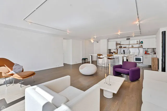 a kitchen with a table and chairs