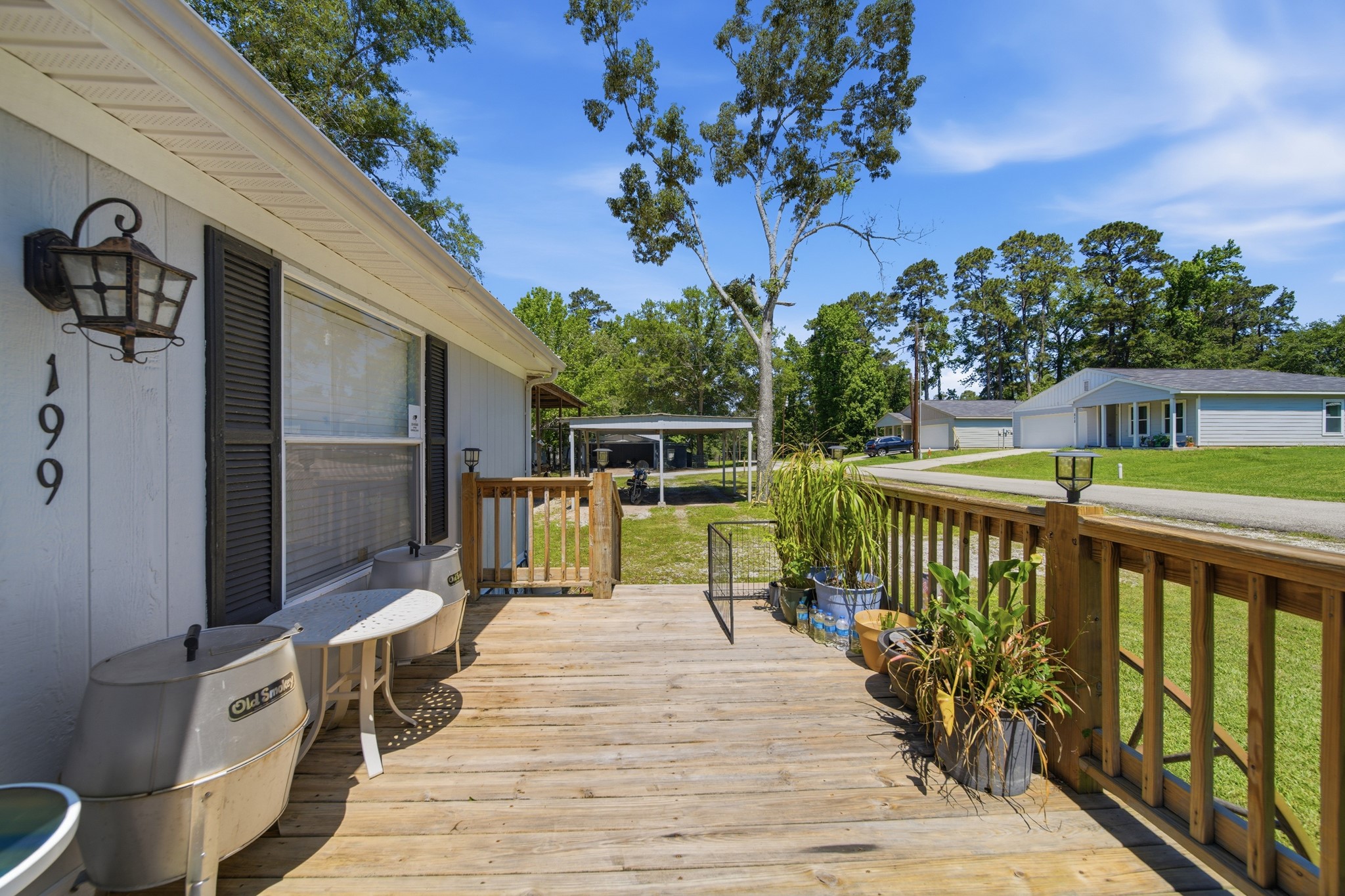 199 Apple Tree Livingston, TX 77351 - Photo 16 of 41 a balcony with wooden floor and outdoor seating