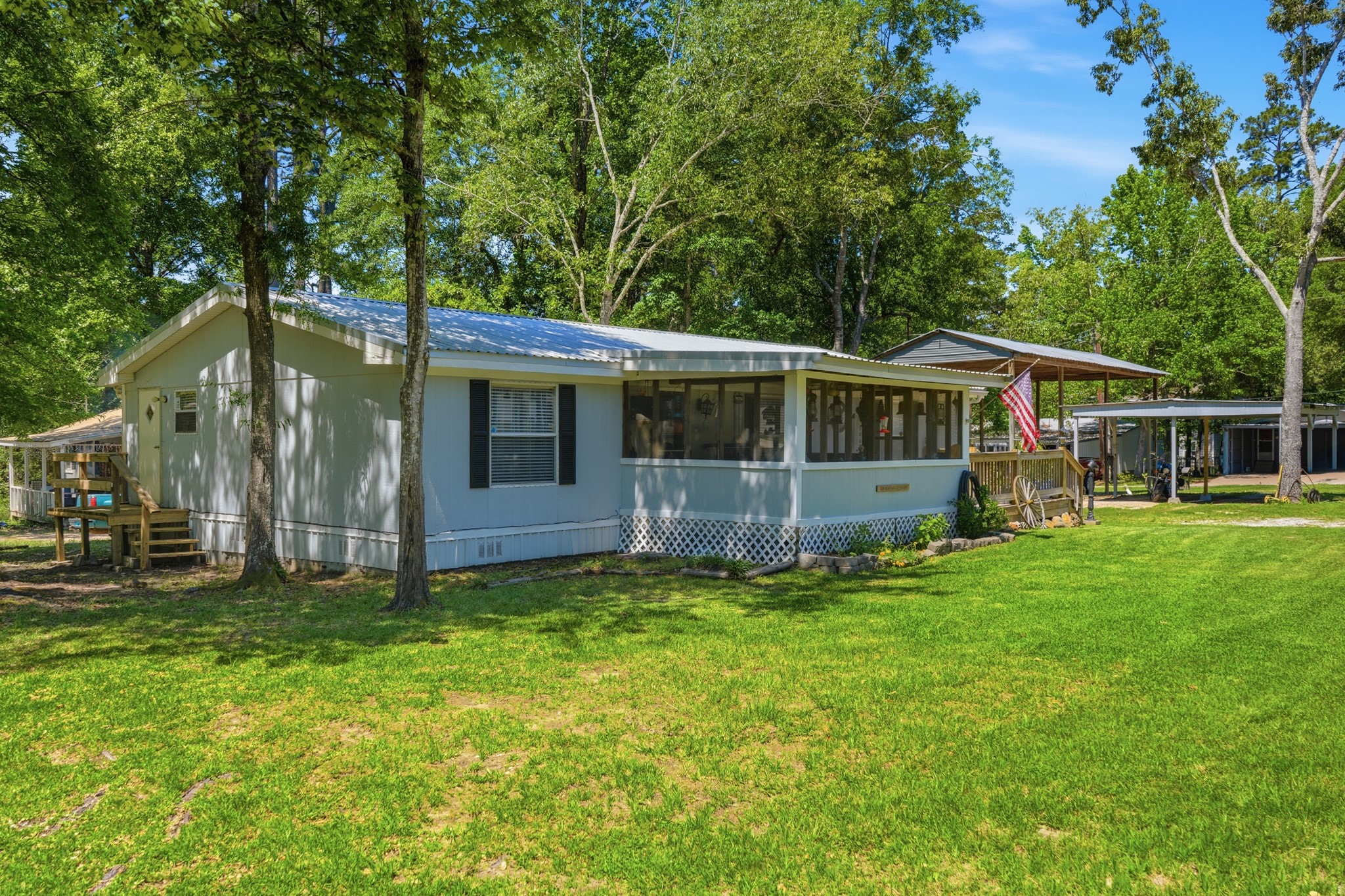 199 Apple Tree Livingston, TX 77351 - Photo 2 of 41 Large screened in front porch in the front.