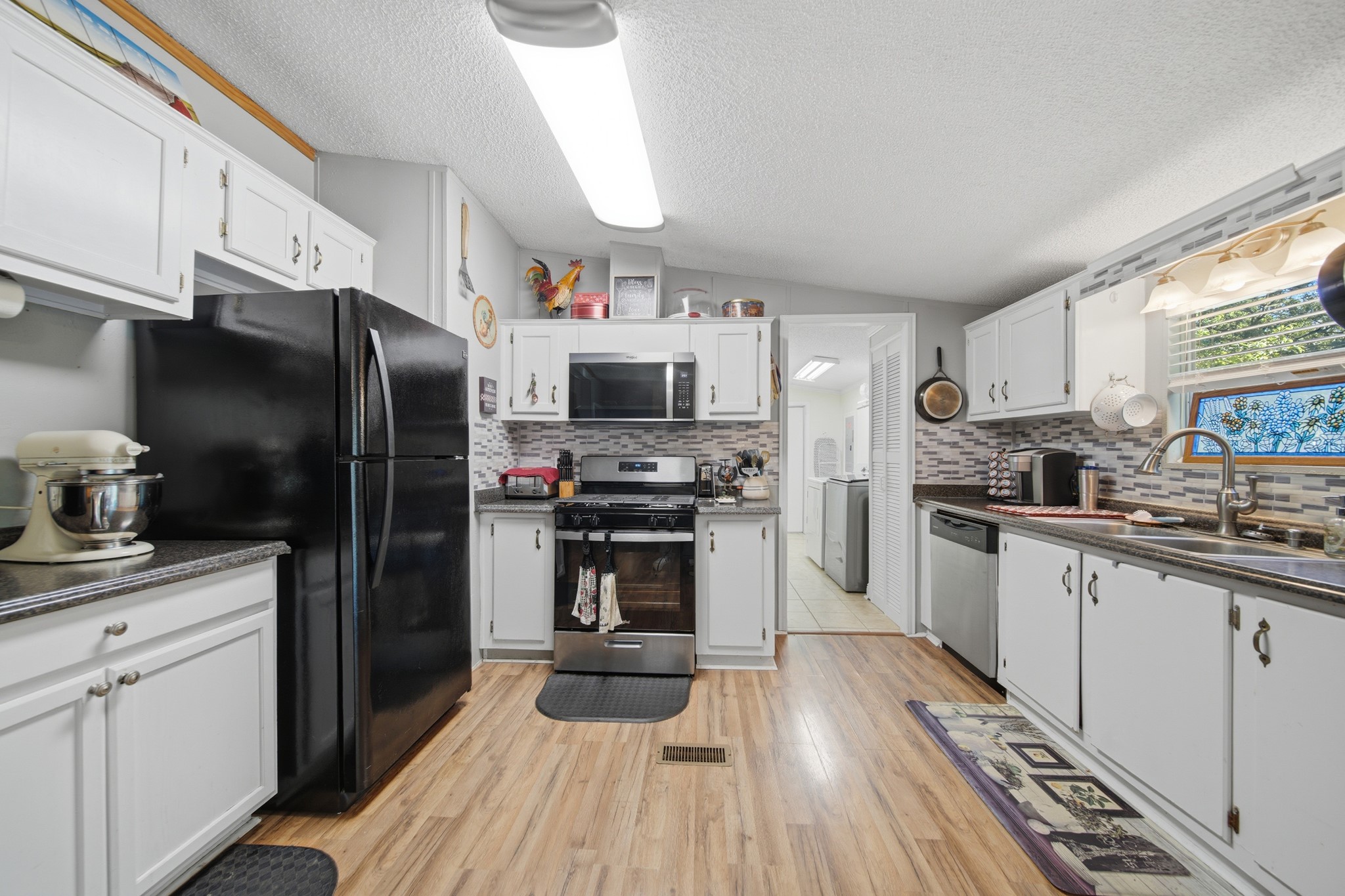 199 Apple Tree Livingston, TX 77351 - Photo 23 of 41 Spacious Kitchen that leads into the laundry area.