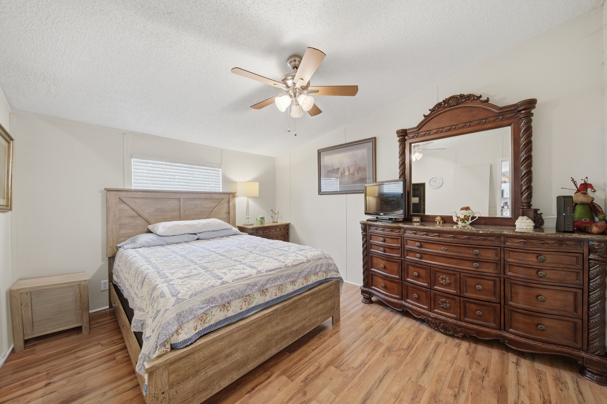 199 Apple Tree Livingston, TX 77351 - Photo 32 of 41 a bedroom with a bed and a dresser