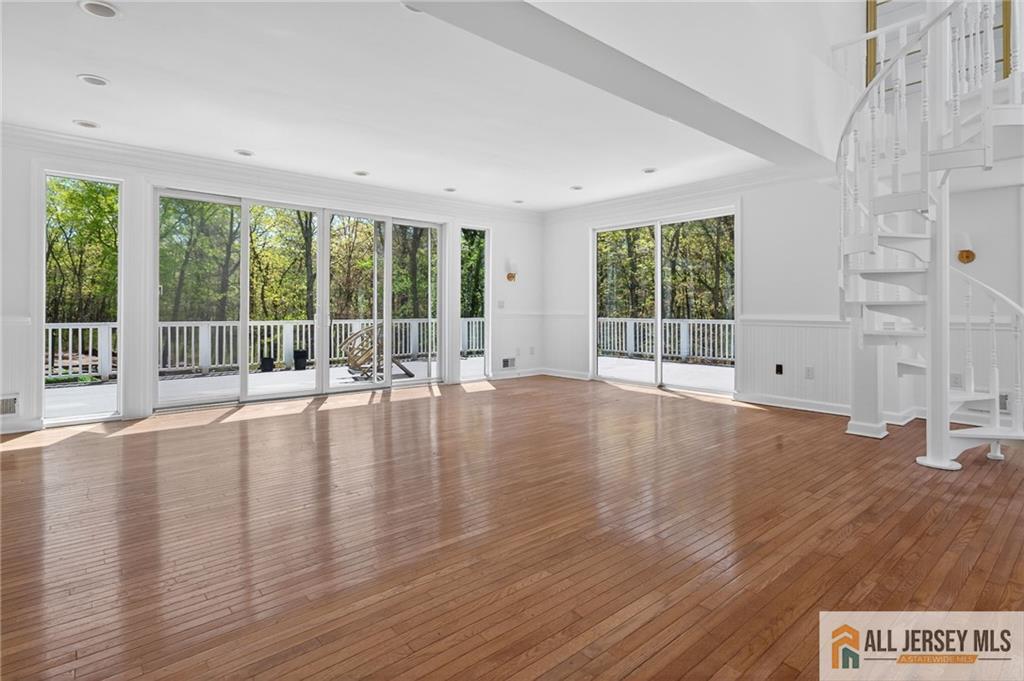 381 Monmouth Road Freehold, NJ 07728 - Photo 36 of 63 a view of empty room with wooden floor and fan