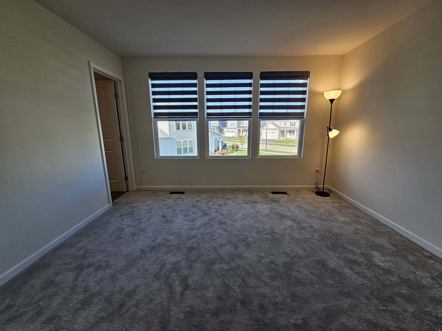 5954 Hawkweed Drive, Unit 5954 Plainfield, IL 60585 - Photo 16 of 35 an empty room with windows