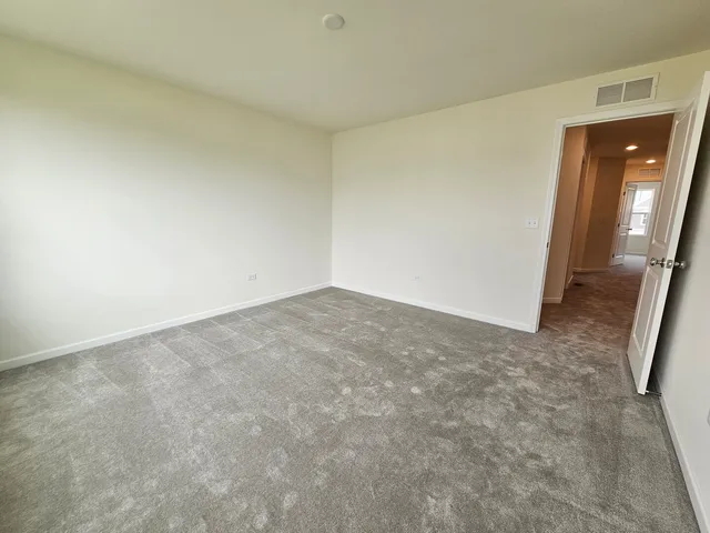 an empty room with a mirror