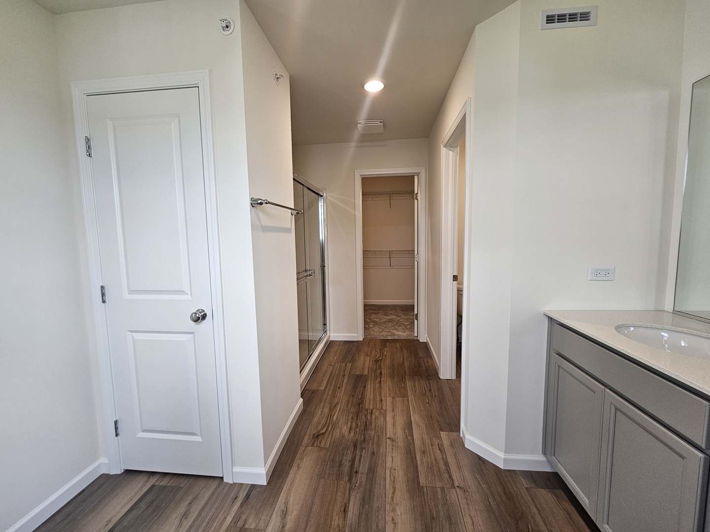 5954 Hawkweed Drive, Unit 5954 Plainfield, IL 60585 - Photo 20 of 35 a view of a hallway with wooden floor and staircase