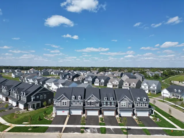 a view of swimming pool with outdoor seating and city view
