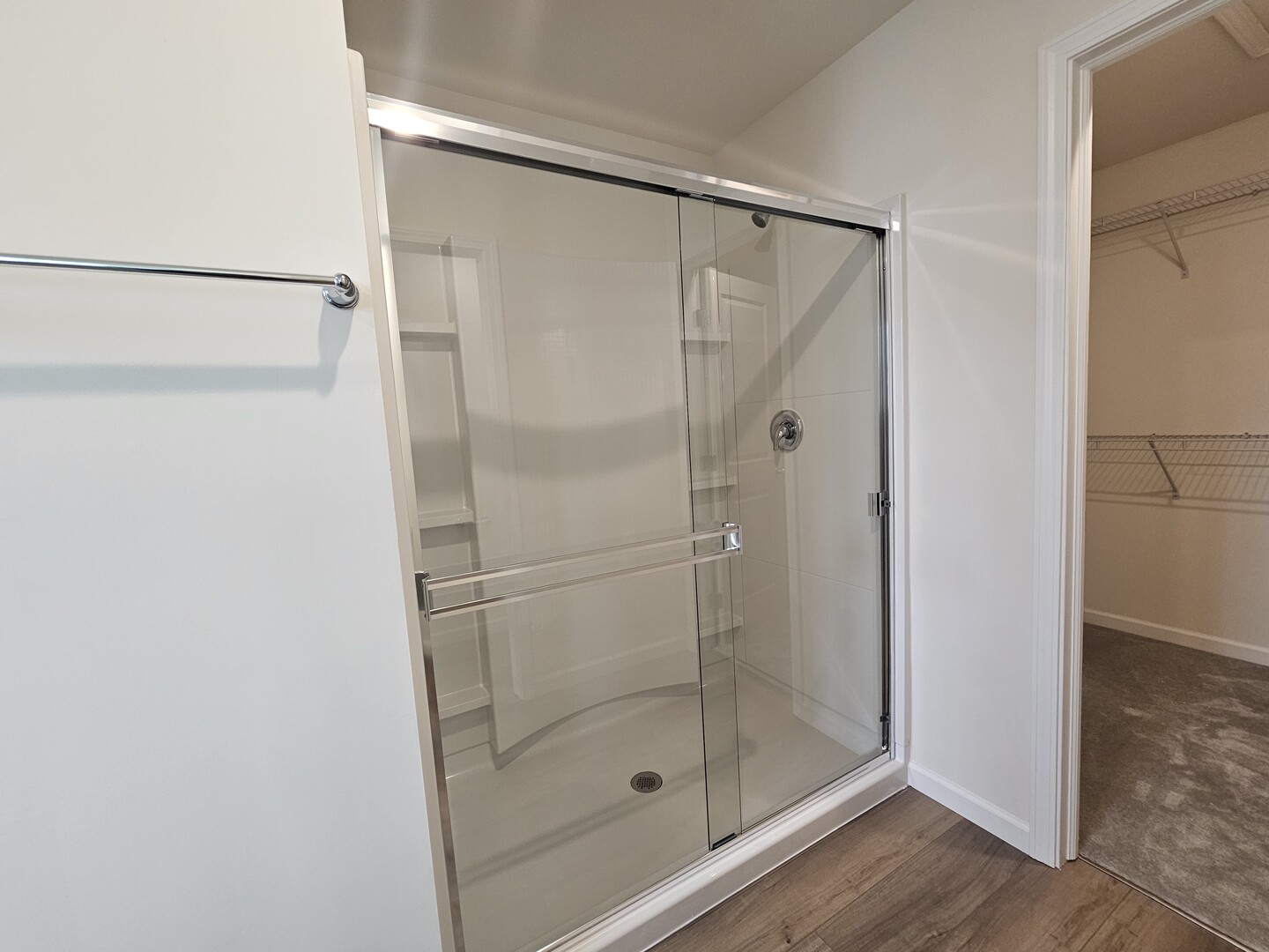 5954 Hawkweed Drive, Unit 5954 Plainfield, IL 60585 - Photo 21 of 35 a bathroom with a glass shower door