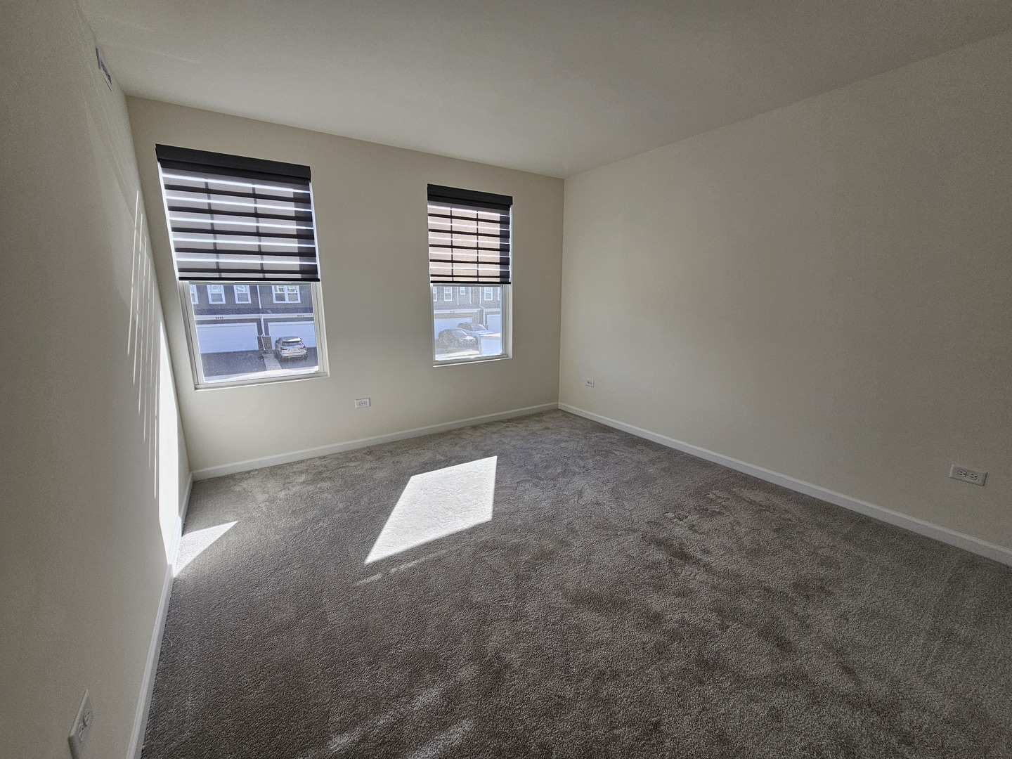 5954 Hawkweed Drive, Unit 5954 Plainfield, IL 60585 - Photo 28 of 35 an empty room with windows