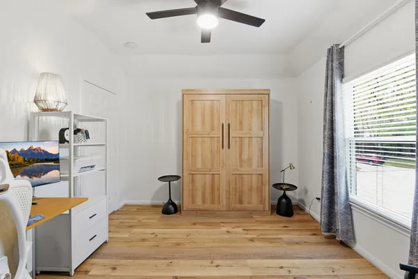 a view of a room with gym equipment and equipment