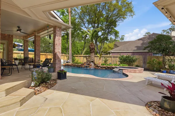 a view of swimming pool with outdoor seating