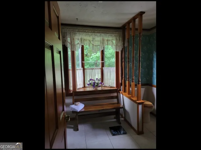 a room with stairs and furniture