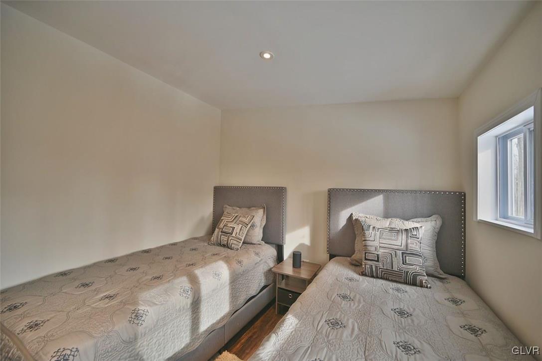 1412 Donalds Road Effort, PA 18330 - Photo 18 of 30 a bedroom with a bed and wooden floor