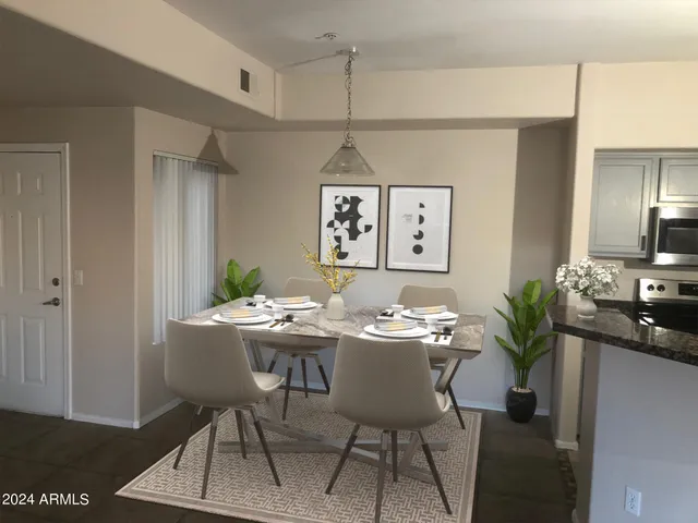 a view of a dining room with furniture