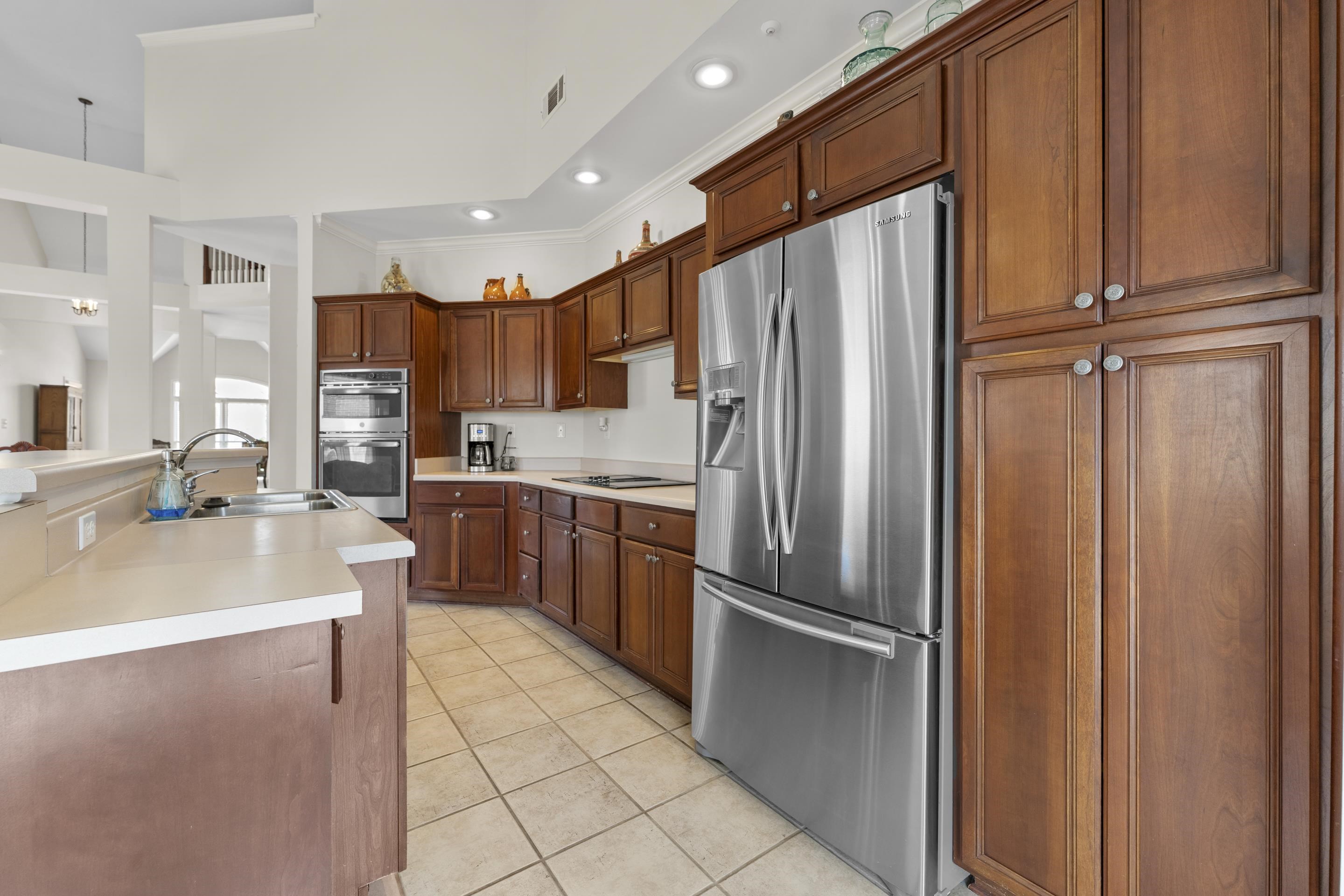 1701 Village Ridge Place Collierville, TN 38017 - Photo 13 of 38 a kitchen with stainless steel appliances granite countertop a refrigerator and a sink