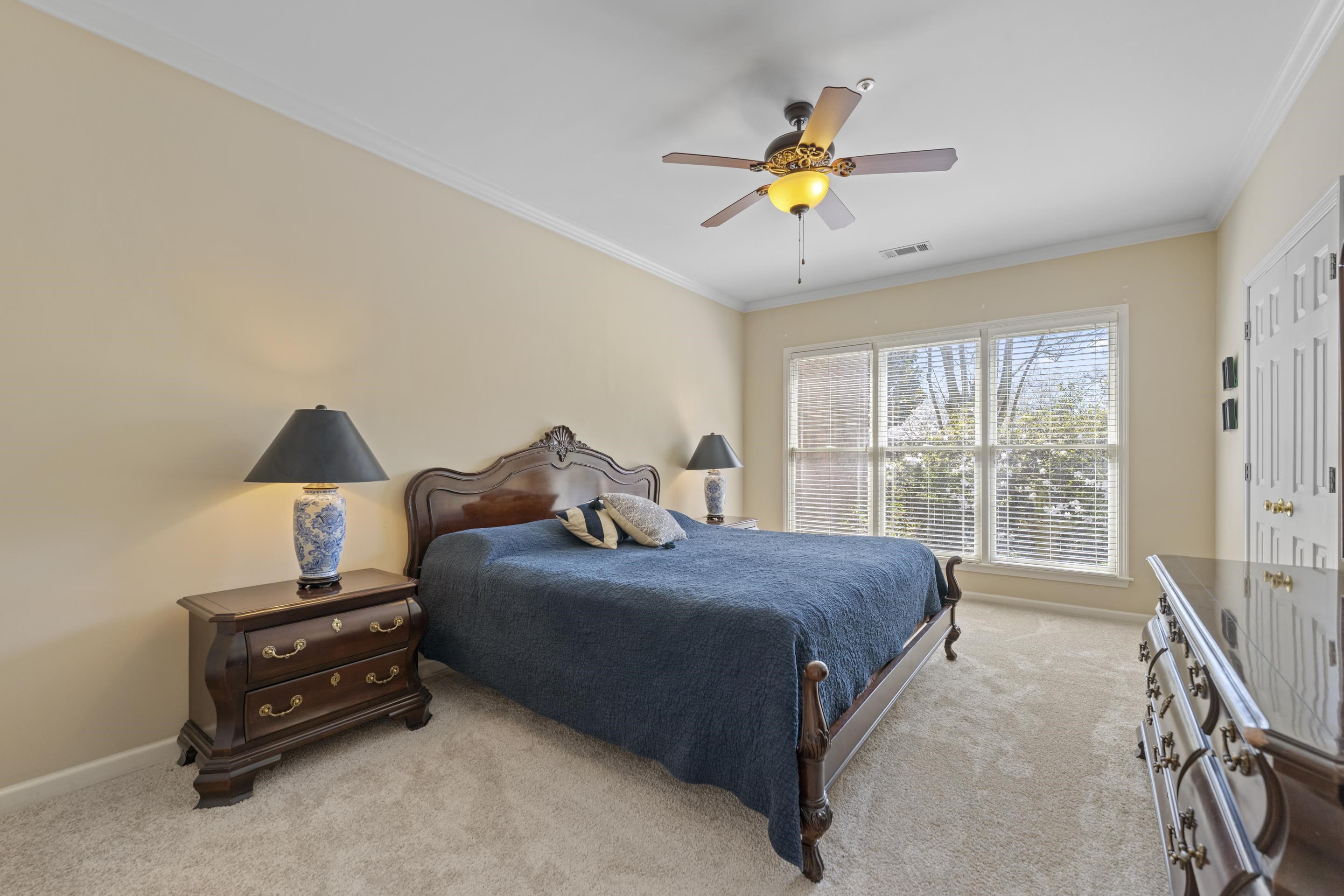 1701 Village Ridge Place Collierville, TN 38017 - Photo 17 of 38 a bedroom with a bed and a chandelier