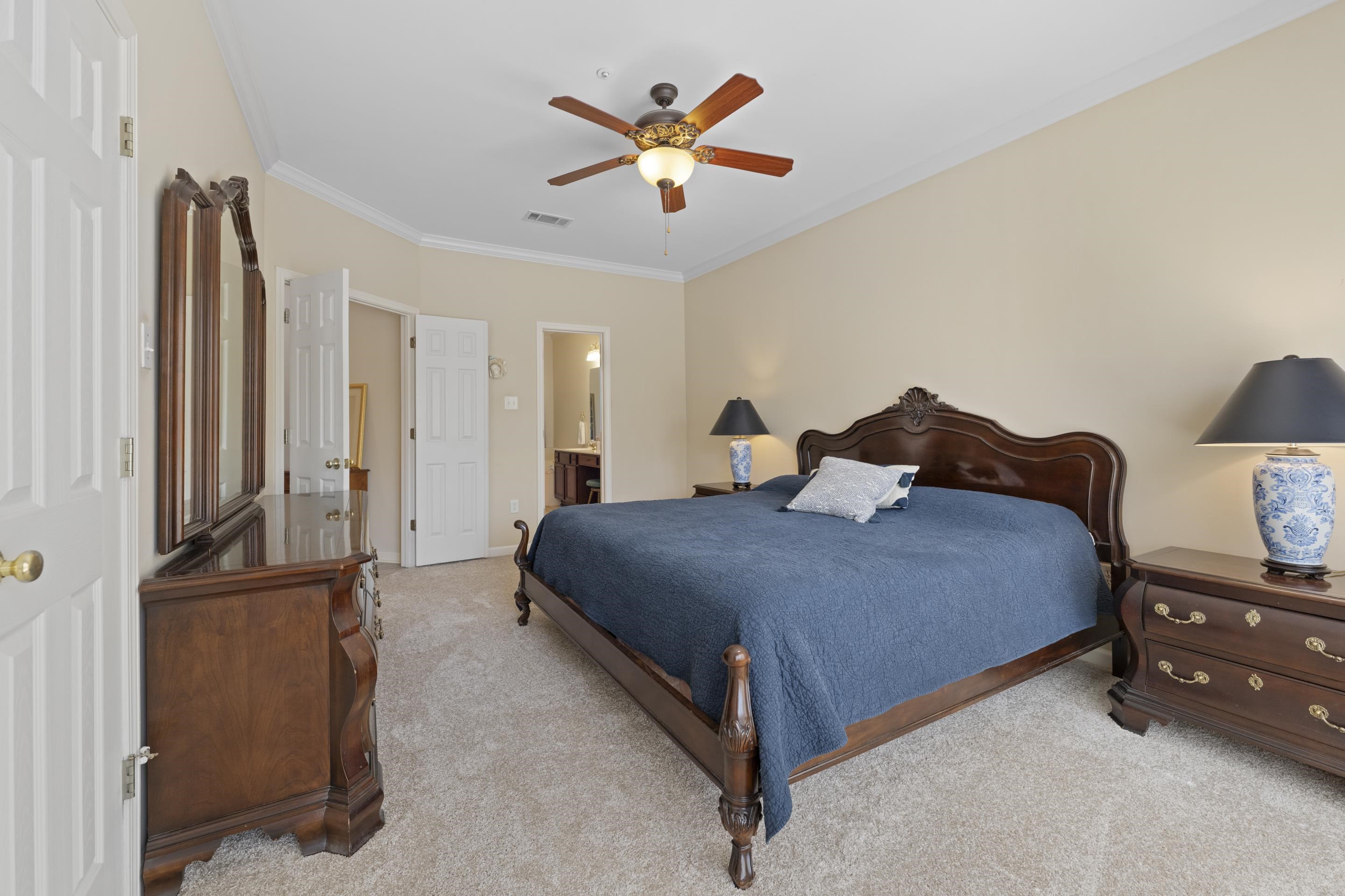 1701 Village Ridge Place Collierville, TN 38017 - Photo 18 of 38 a bedroom with a bed and ceiling fan