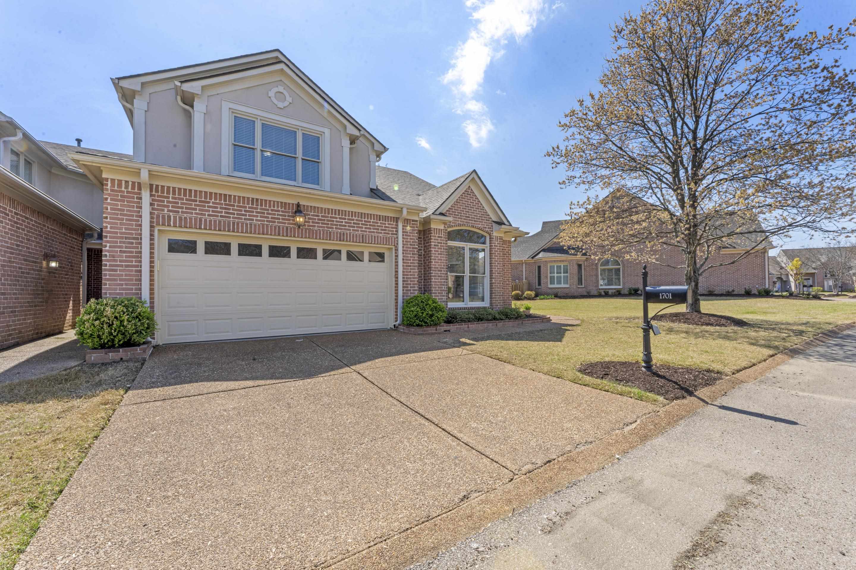 1701 Village Ridge Place Collierville, TN 38017 - Photo 2 of 38 a front view of building with yard