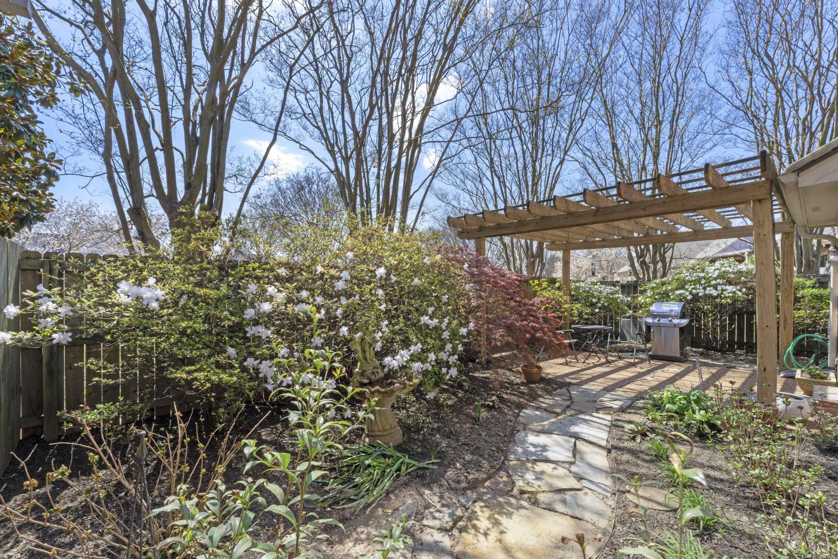 1701 Village Ridge Place Collierville, TN 38017 - Photo 29 of 38 a view of a patio with table and chairs and potted plants