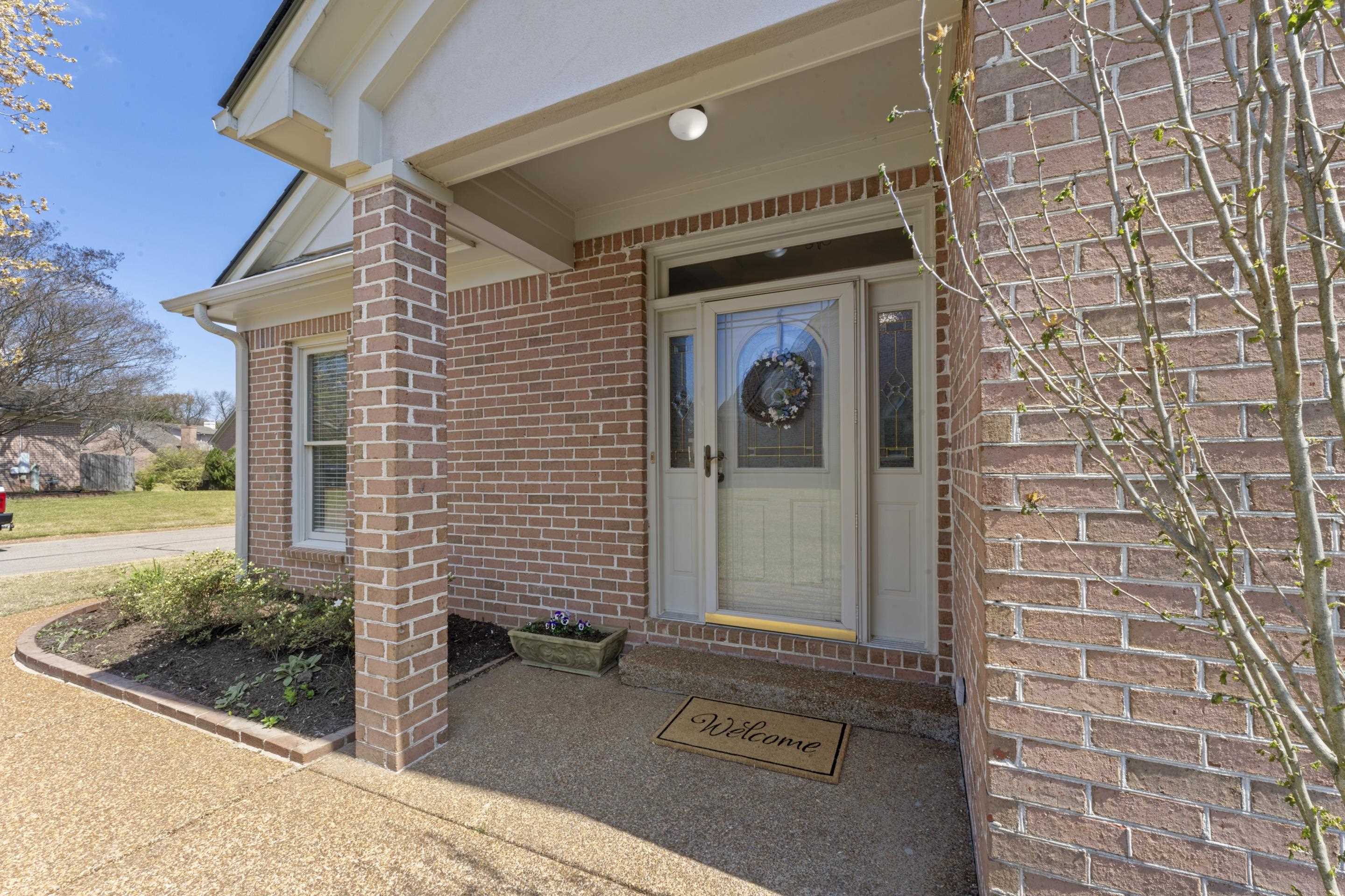 1701 Village Ridge Place Collierville, TN 38017 - Photo 32 of 38 a front view of a house with a yard