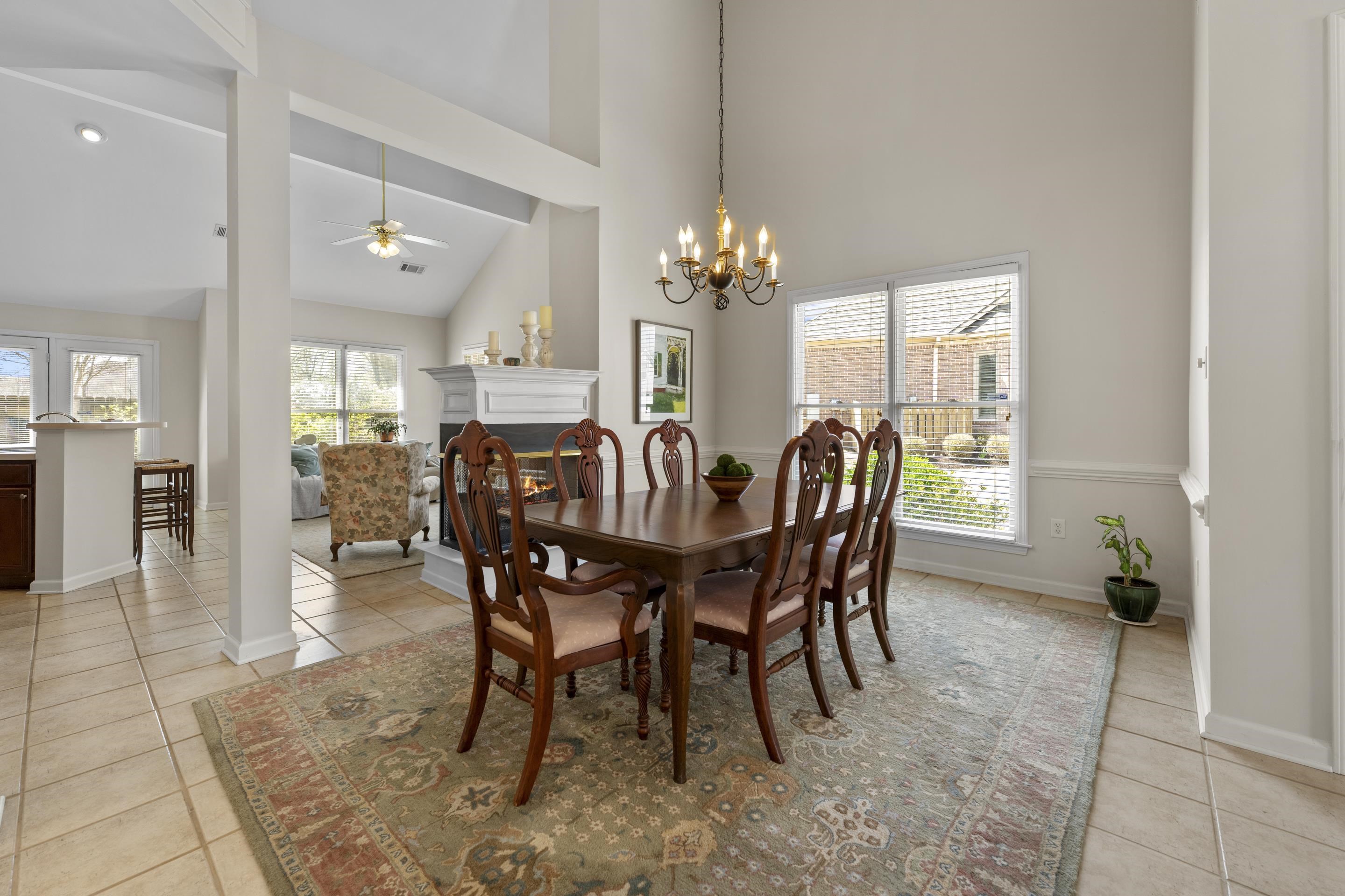 1701 Village Ridge Place Collierville, TN 38017 - Photo 8 of 38 a dining room with furniture a chandelier and wooden floor