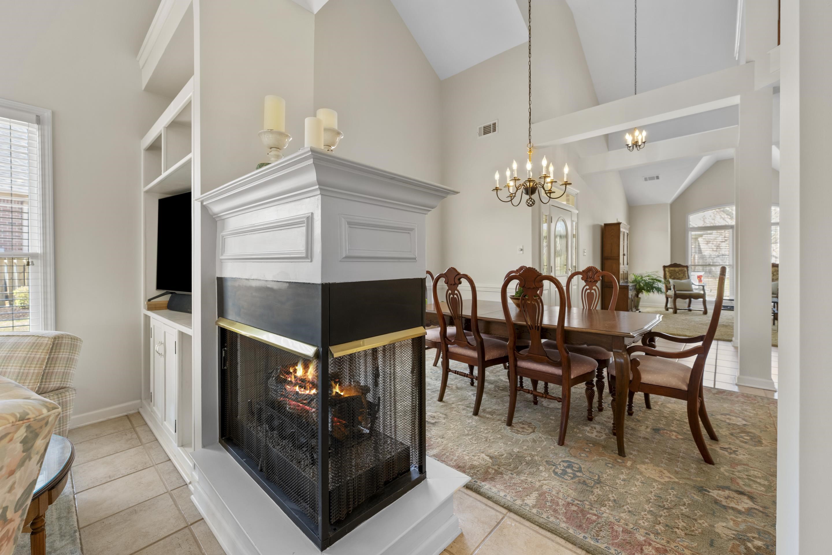 1701 Village Ridge Place Collierville, TN 38017 - Photo 9 of 38 a view of a dining room with furniture and chandelier