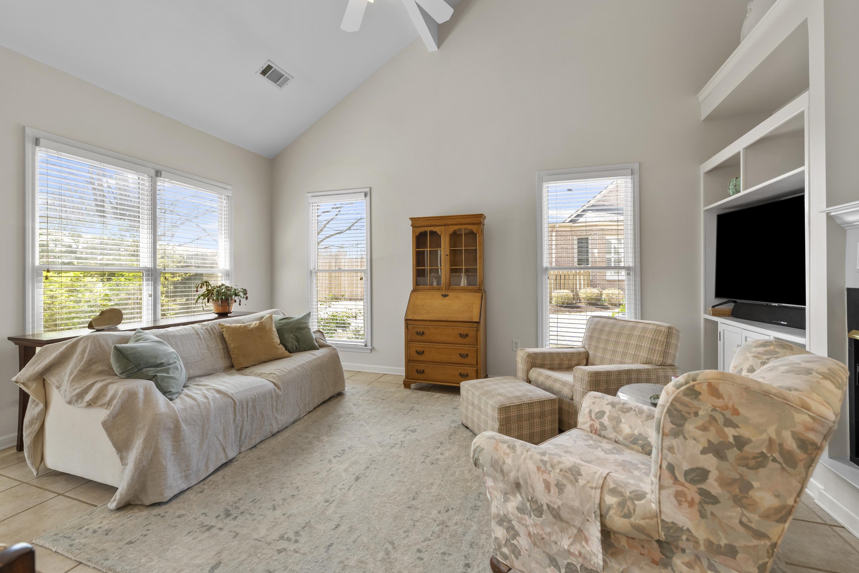 1701 Village Ridge Place Collierville, TN 38017 - Photo 10 of 38 a living room with furniture and a flat screen tv