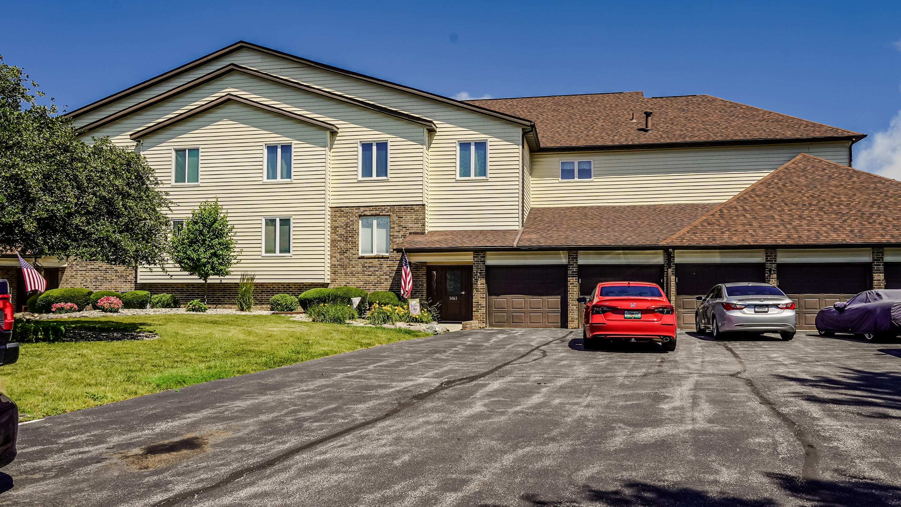 5065 Spinnaker Lane, Unit D Crown Point, IN 46307 - Photo 42 of 42 a car parked in front of a house