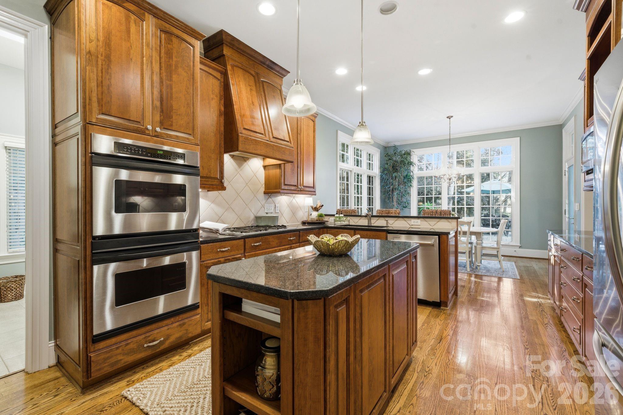 185 Quaker Road Mooresville, NC 28117 - Photo 15 of 43 a kitchen with a sink stove and cabinets
