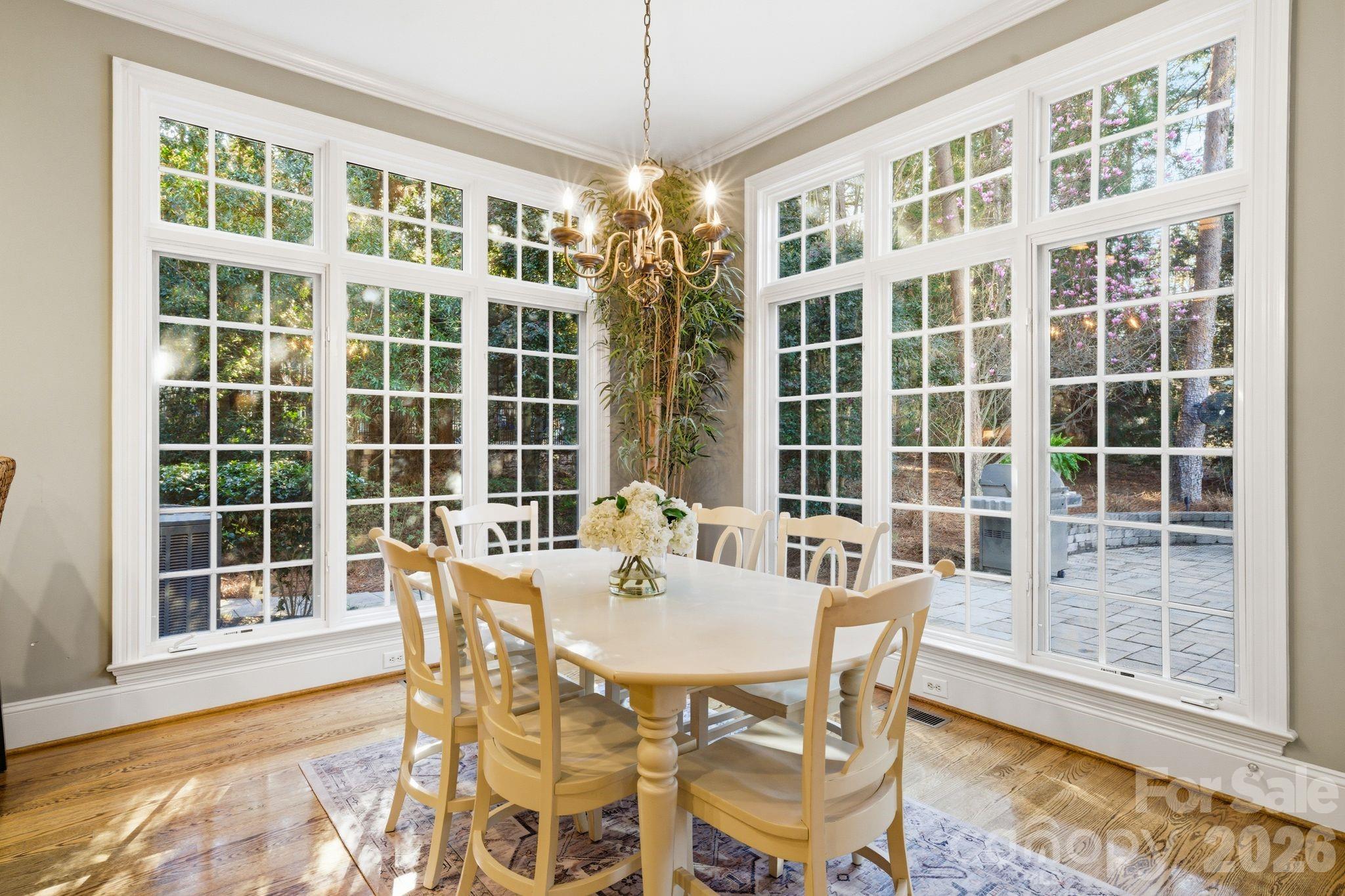 185 Quaker Road Mooresville, NC 28117 - Photo 18 of 43 a table and chairs in a room next to a window