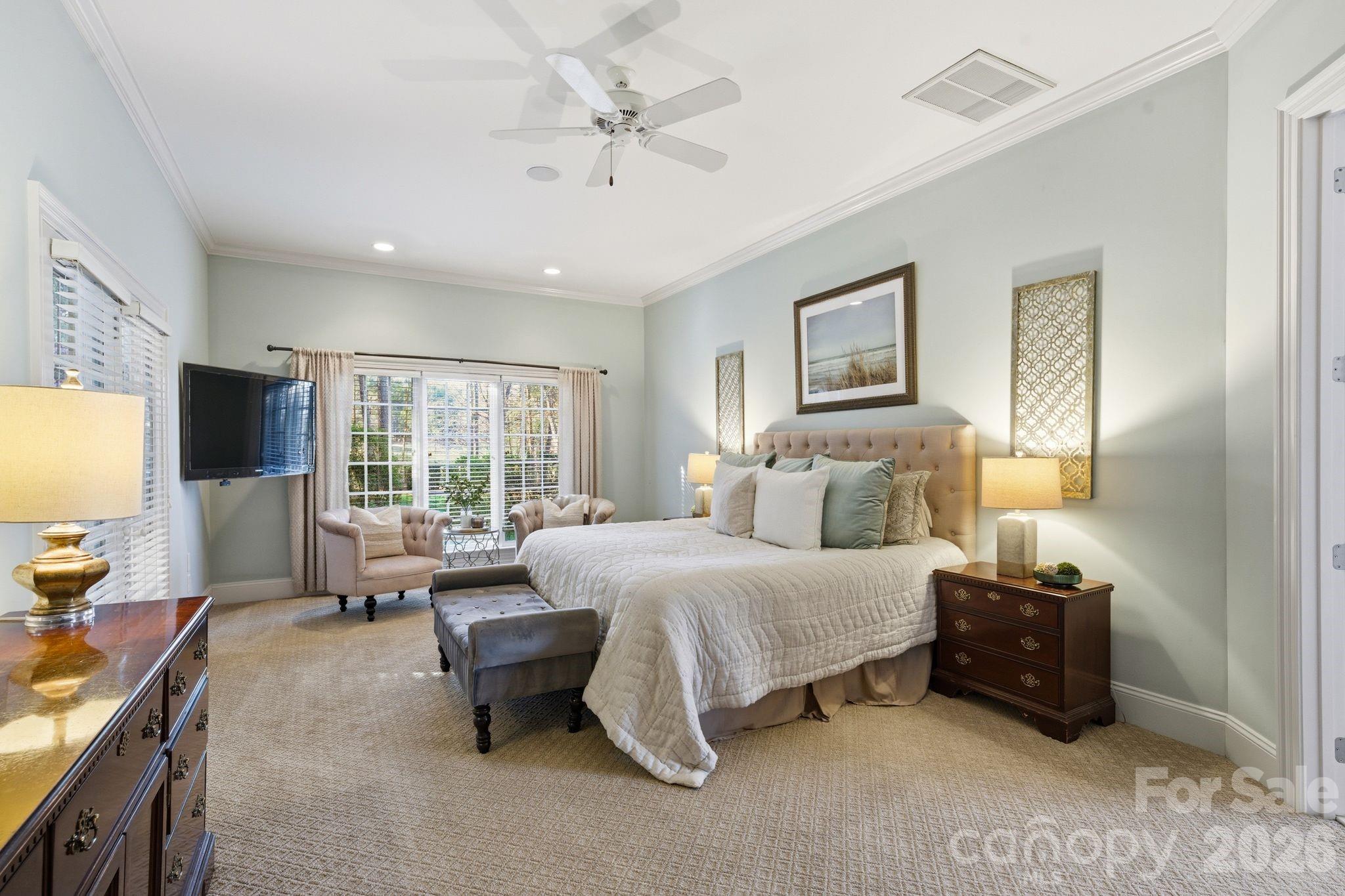 185 Quaker Road Mooresville, NC 28117 - Photo 22 of 43 a bedroom with a bed and large windows