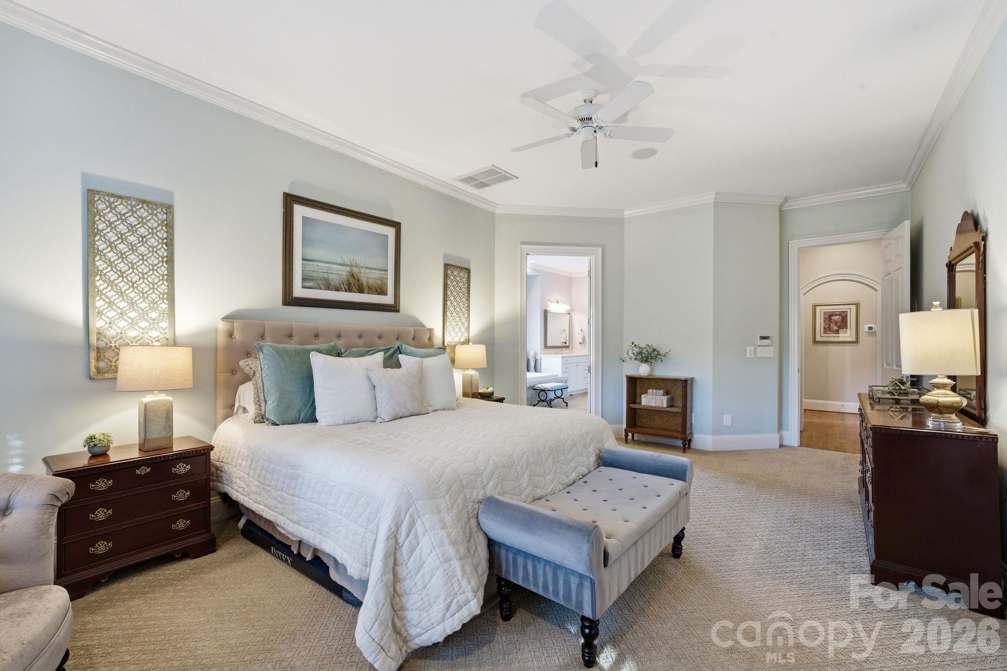 185 Quaker Road Mooresville, NC 28117 - Photo 23 of 43 a spacious bedroom with a bed and couch