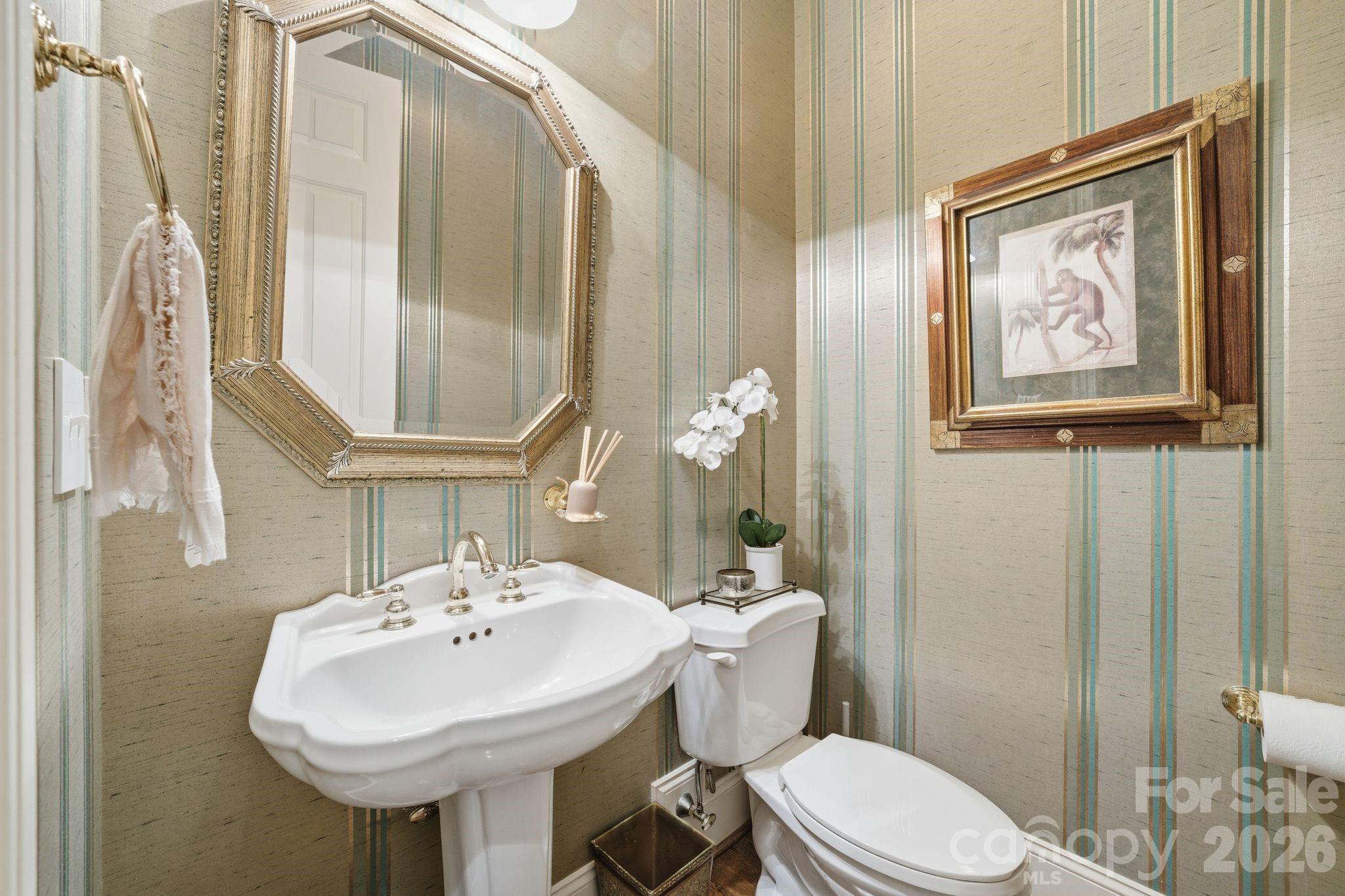 185 Quaker Road Mooresville, NC 28117 - Photo 26 of 43 a bathroom with a toilet sink and mirror