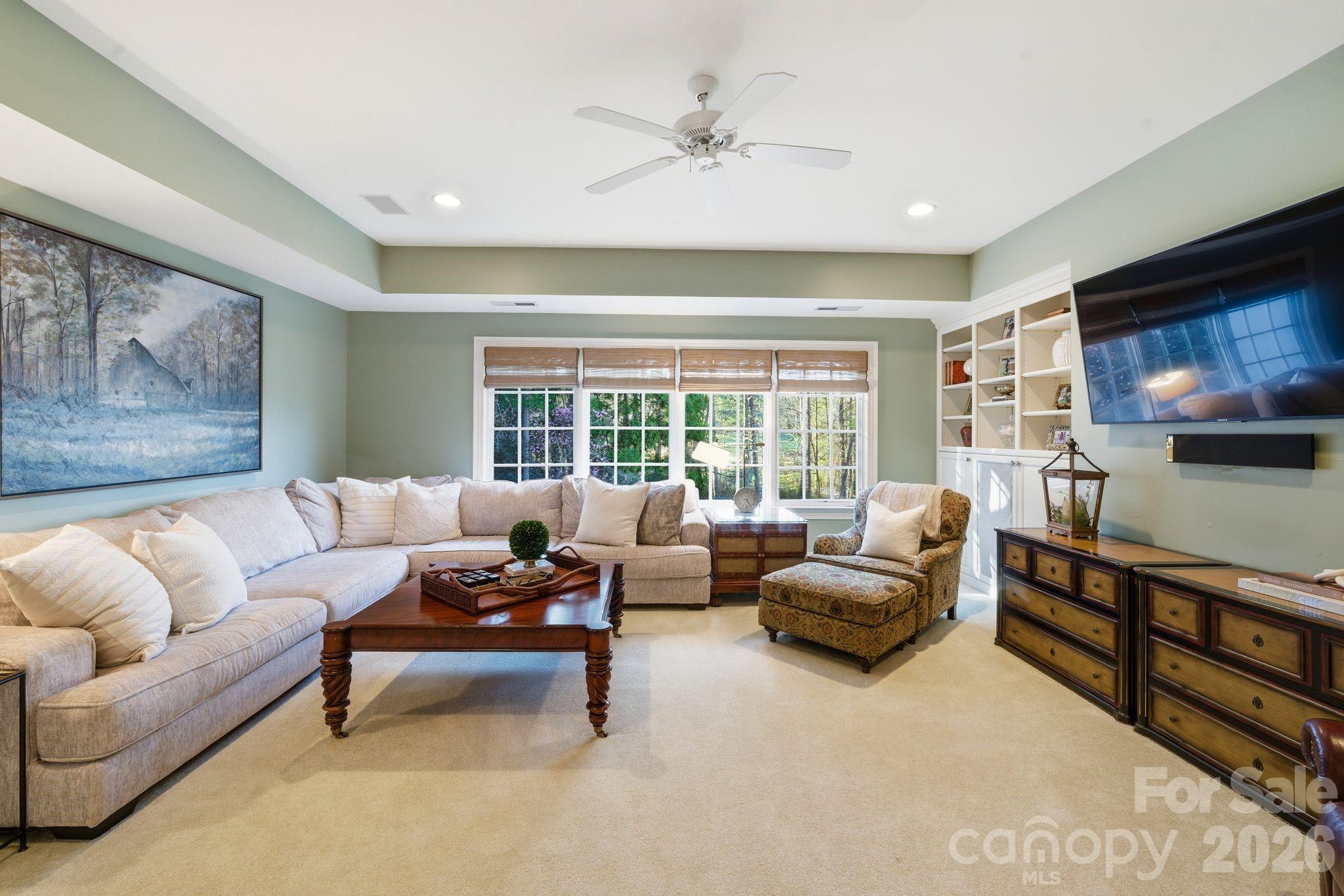 185 Quaker Road Mooresville, NC 28117 - Photo 33 of 43 a living room with furniture and a flat screen tv