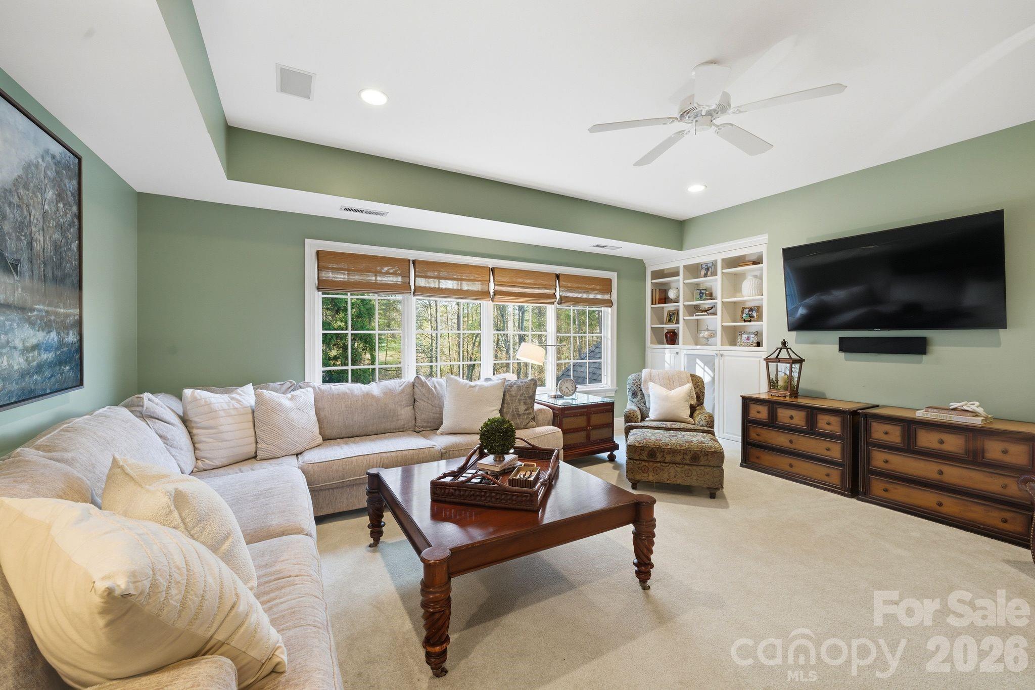 185 Quaker Road Mooresville, NC 28117 - Photo 34 of 43 a living room with furniture and a flat screen tv