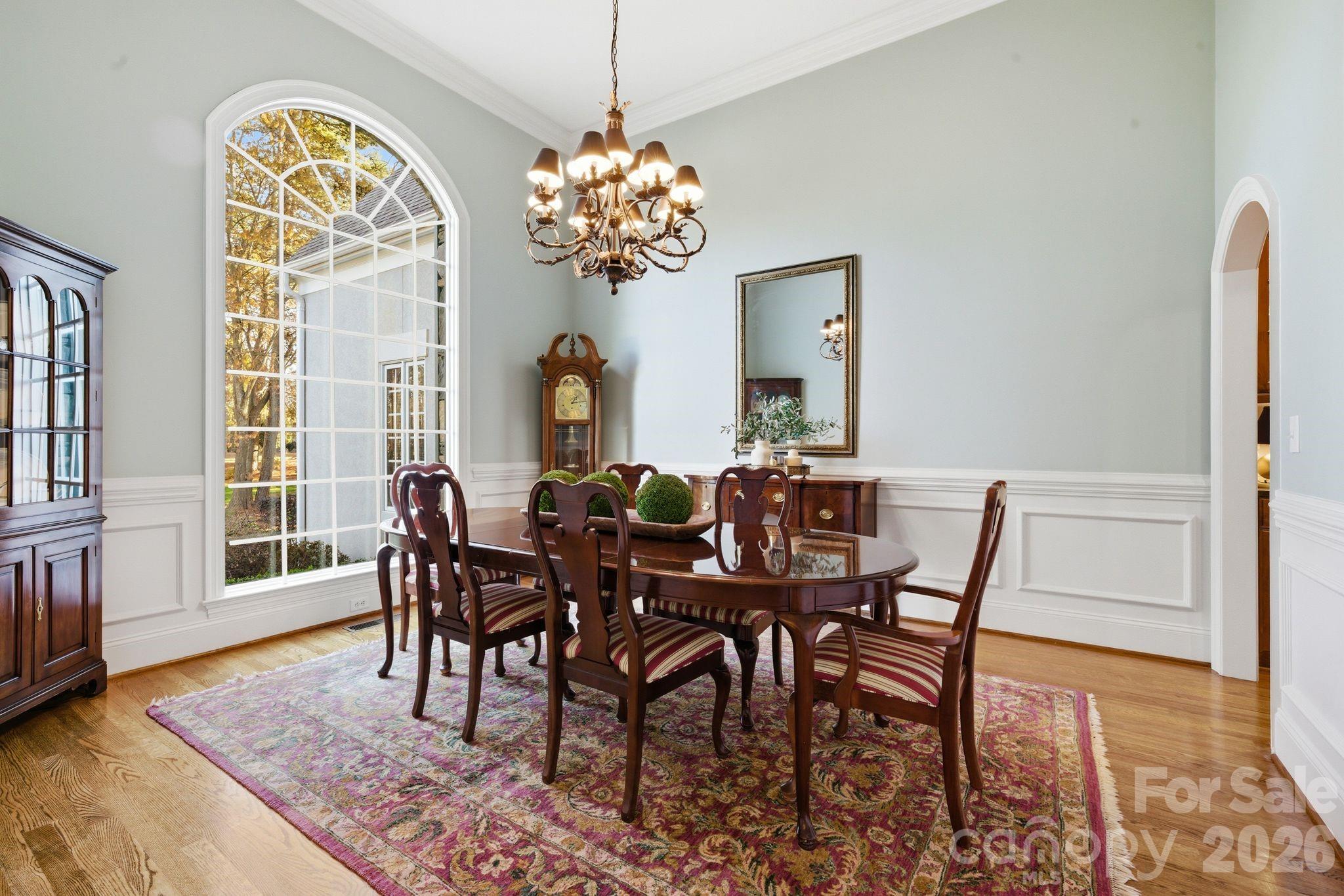 185 Quaker Road Mooresville, NC 28117 - Photo 8 of 43 a view of a dining room and hall with wooden floor