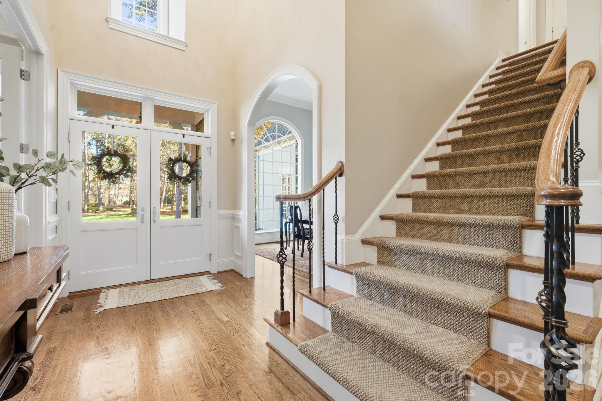 185 Quaker Road Mooresville, NC 28117 - Photo 9 of 43 a view of entryway with wooden floor and stairs