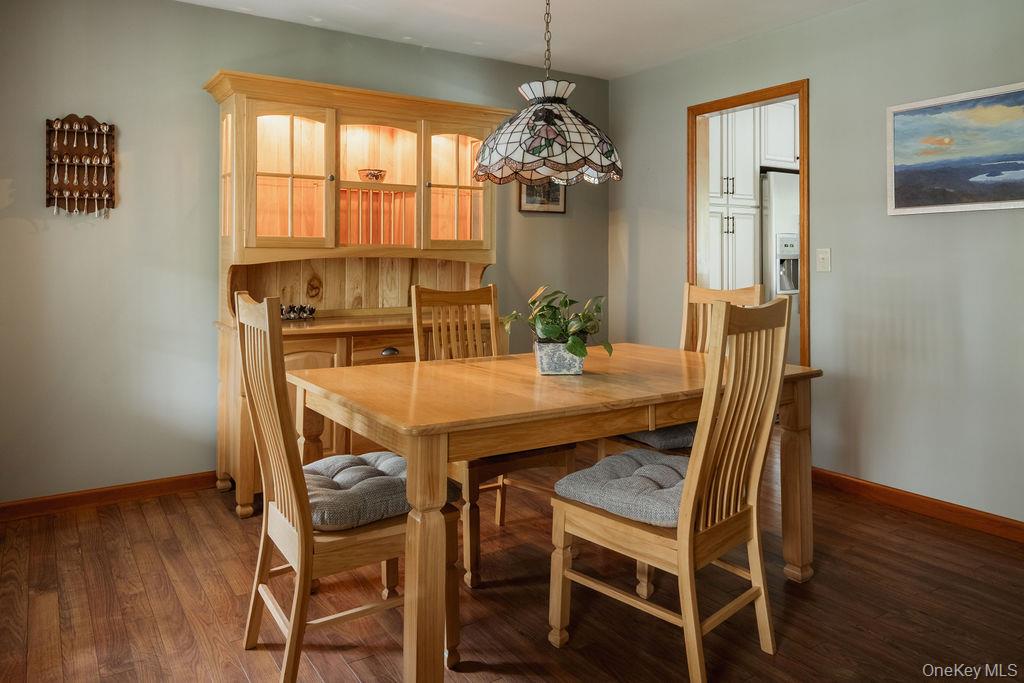 4 Echo Valley Road Red Hook, NY 12571 - Photo 11 of 33 a dining room with furniture a chandelier and wooden floor