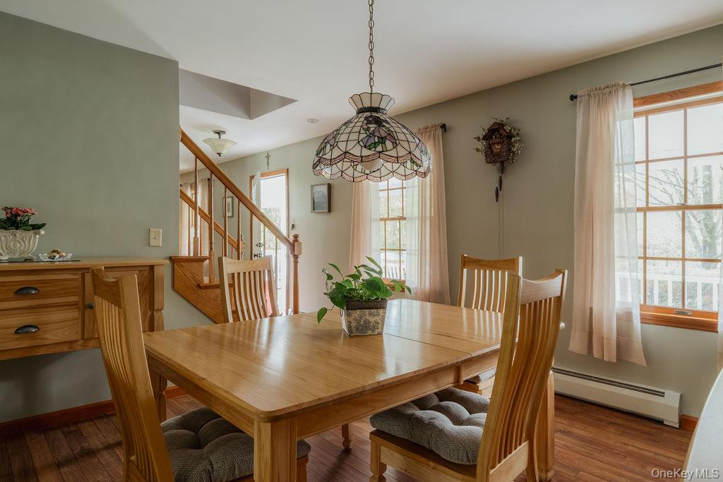 4 Echo Valley Road Red Hook, NY 12571 - Photo 12 of 33 a view of a dining room with furniture window and wooden floor