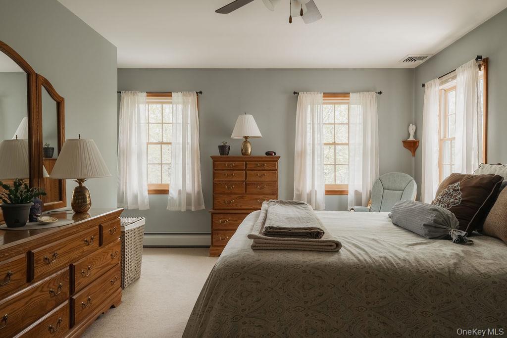 4 Echo Valley Road Red Hook, NY 12571 - Photo 15 of 33 a bedroom with a bed and a dresser