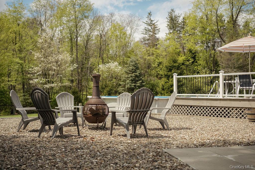 4 Echo Valley Road Red Hook, NY 12571 - Photo 30 of 33 a porch with a bench and chairs