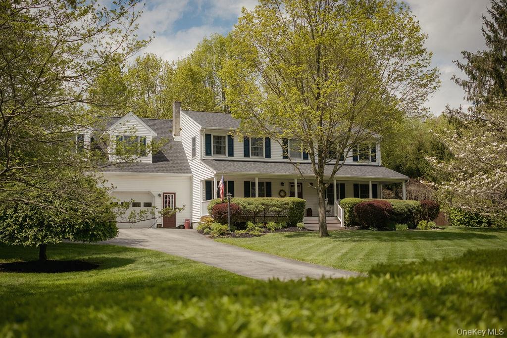 4 Echo Valley Road Red Hook, NY 12571 - Photo 33 of 33 a front view of a house with a garden