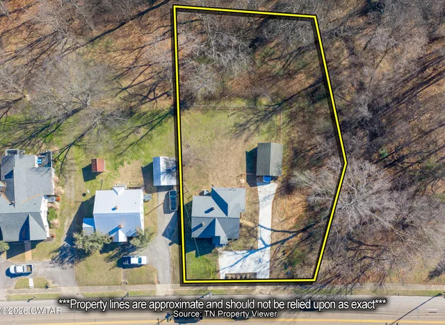 an aerial view of residential house with outdoor space